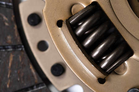 Close-up on the new clutch disc. Background preparation for repairs of the chassis and gearboxの写真素材