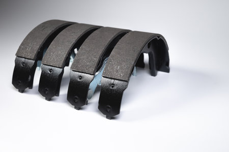 New set of four brake pads for drum brakes on a gray backgroundの写真素材