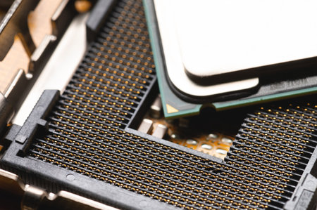 Blank cpu cpu socket with pins on motherboard in yellow color close-upの写真素材