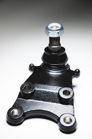 off-road Ball joint car suspension on a gray background. New spare parts axel car elements