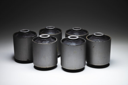 Close-up. A group of cylindrical silent blocks for the rear suspension of an off-road vehicle....
