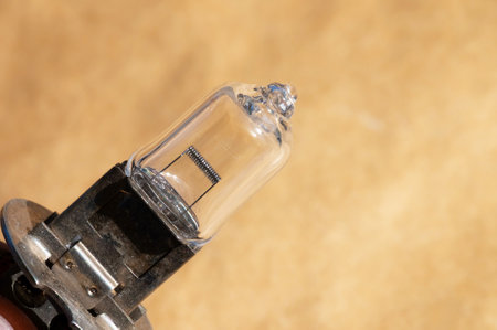 Close-up of a car lamp h1. Close-up view of an incandescent element of a halogen lampの写真素材