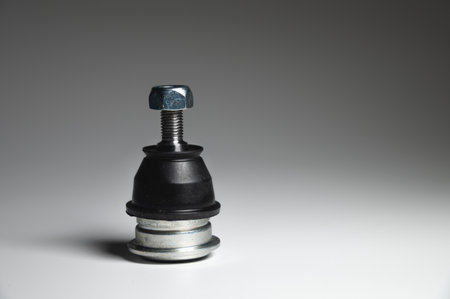 Ball joint car suspension on a gray background. New spare parts axel car elementsの写真素材
