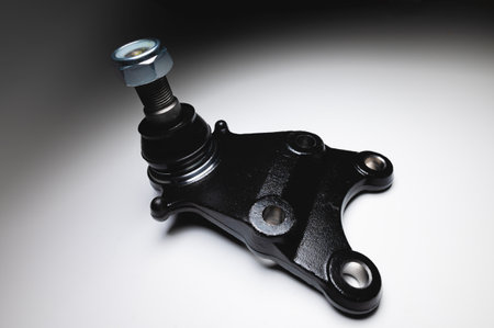 off-road Ball joint car suspension on a gray background. New spare parts axel car elements