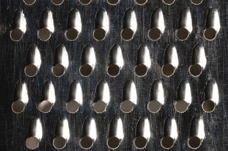 Abstract metal texture of rusted food graterの写真素材