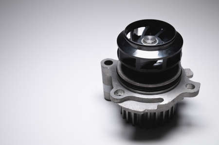 Water pump of the internal combustion engine cooling system. Contrasting on a gray gradientの写真素材
