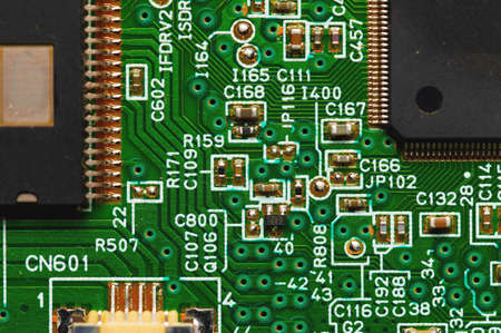Green electronic board with radioelements close-up. Background for the theme of electronics and high...