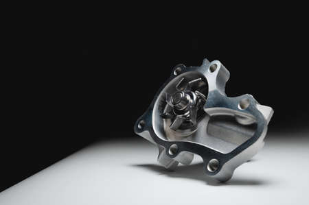Water pump of the internal combustion engine cooling system. Contrasting on a gray gradientの写真素材