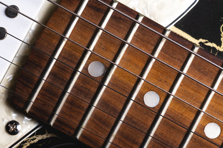 Close-up elements of electric guitar on gray backgroundの写真素材