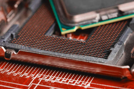 close-up of a printed circuit board with microchips and radio parts with a processor. Background for...