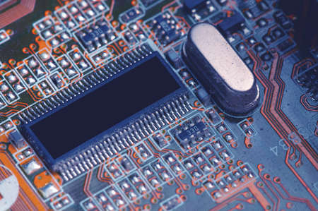 close-up of a printed circuit board with microchips and radio parts with a processor. Background for...