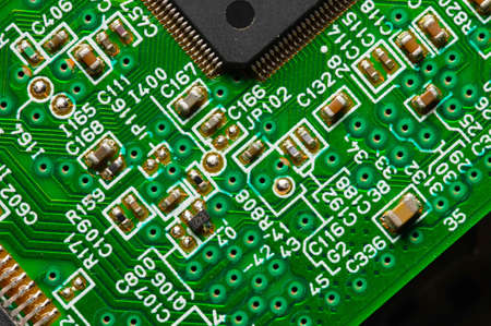 close-up of a printed circuit board with microchips and radio parts with a processor. Background for...