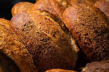 Freshly baked hot loaves of crispy artisan bread close-up. Healthy foods and proper nutrition