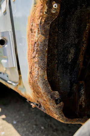 Rusty wheel arches on the car. car corrosion. Background for welding work on the restoration of the car bodyの写真素材