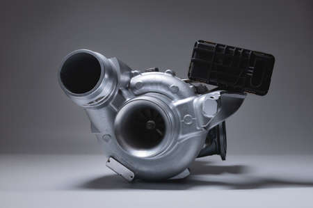 New metal turbocharger. Exhaust gas blower. Parts backgroundの写真素材