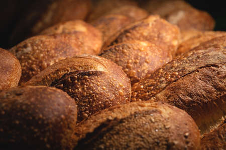 Freshly baked loaves of crispy artisan bread close upの写真素材
