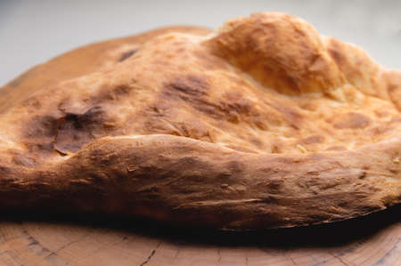 Close-up of fresh appetizing pita bread. delicious baked food
