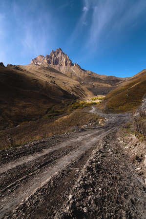 Autumn day on a scenic but difficult 4X4 track located in front of the summit. Off-road, wide angle