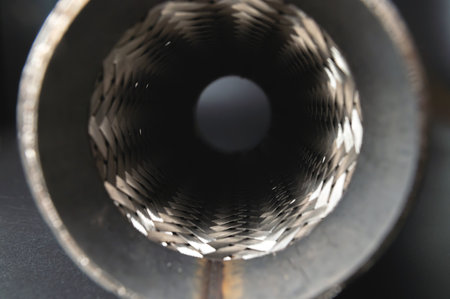 Flexible tubular exhaust pipe. Car Exhaust Compensator. Close-up selective focusの写真素材