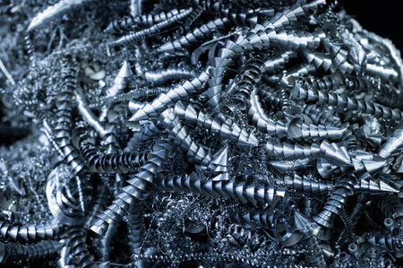 Close-up A lot of metal shavings close-up, after working on a milling machine or CNC machine. Texture of metal shavings macroの写真素材