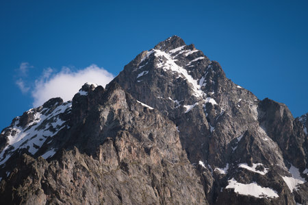View of the Himalayan peaks. Close-up of a secluded mountain peak with snow on a sunny clear day