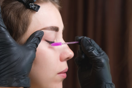 close up of the masters hands holding the brush the master directs the growth of hairs after...
