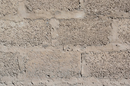 Grey brick wall background close up. Gray stone tile block background with horizontal texture of...