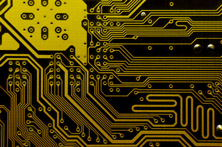 Yellow background of computer motherboard printed circuit board. Macro shot of electronic components