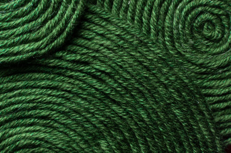 Green thread texture close-up, macro. Sewing thread banner, abstract background