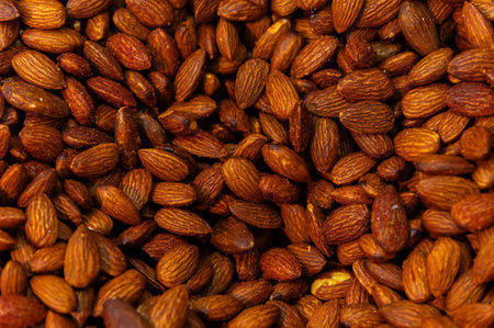 Almond background. Almonds top view background. Whole almond nuts flat lay. Full depth of field. Perfect not AI almond, true photoの写真素材