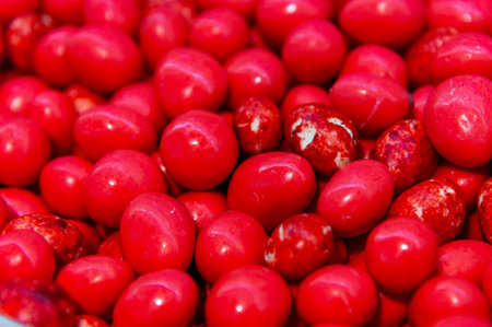 Dessert snacks strawberries in red chocolate. Many on the store counter. Top view of red chocolate...