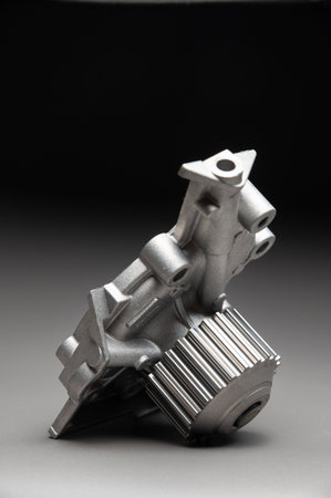 Top-quality parts for your car. Car maintenance. New water pump for a cars engine cooling system on...