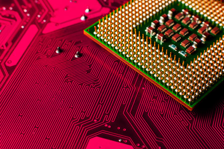 Macro photo of computer or laptop CPU microprocessor processor. Close-up of metallic pins and PCB of...