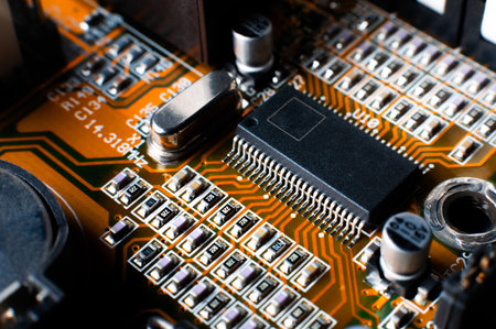 microscheme close up with plenty tiny pieces. Many capacitors, resistors on board. Digital engineering photoの写真素材