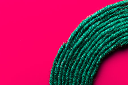 A solid background of colorful threads for cross stitch and needlework. Textured background for needlework and design. Rainbow of threads. Rows of colorful embroidery threads.の写真素材