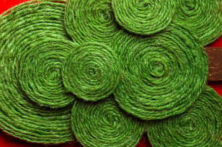 A solid background of colorful threads for cross stitch and needlework. Textured background for needlework and design. Rainbow of threads. Rows of colorful embroidery threads.の写真素材