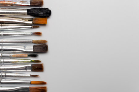 Many different brushes on a white background. Copy space for artistic background.の写真素材