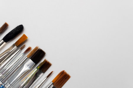 photograph of brushes on a white background. Theres space for an artists sketch. Art and its toolsの写真素材