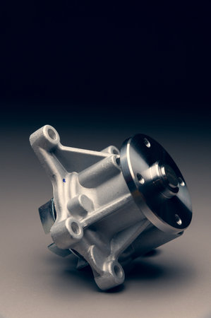 Engine cooling pump, engine coolant pump for a passenger car on a black gradient background. Selective focusの写真素材