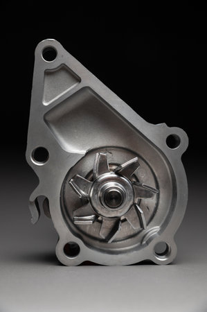 High-quality spare parts for your car. Car maintenance. New water pump for the engine cooling system...