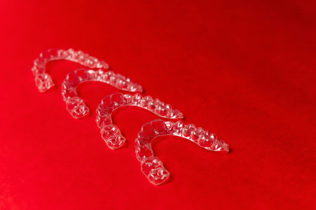 Clear aligners and braces on a colored background. Dental background.