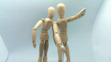 Wooden puppet isolated on whiteの素材