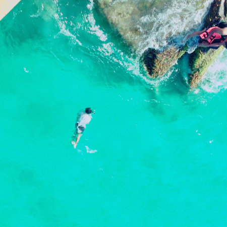 People diving in deep blue sea