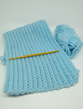 Crochet work, blue yarn and crochet hookの写真素材