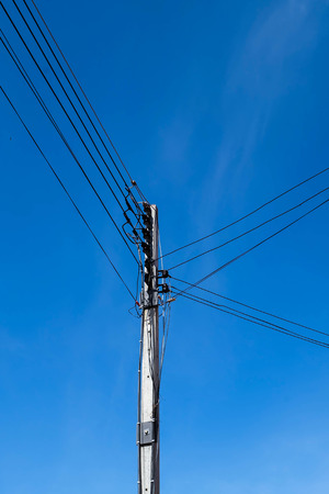 Electricity pole with blue sky backgroundの写真素材