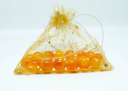 Yellow orange bracelet beads in a gift bagの写真素材
