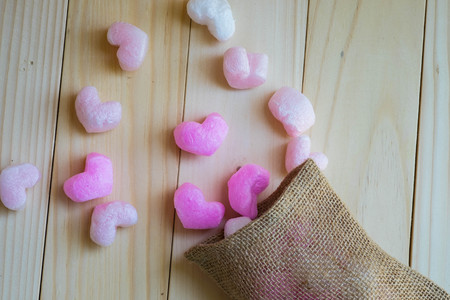 Pink heart spill out from sackの写真素材