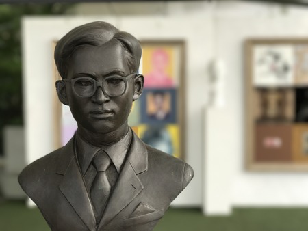 December 26, 2016 - Bangkok, Thailand: Young King Rama 9 bust in formal attire showed at Tha Maharaj. The exhibition attributed to condole and pay respect to Thai passed away King Rama 9.のeditorial素材