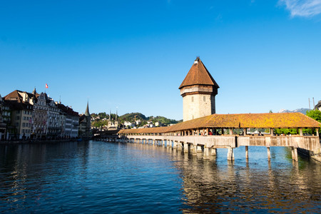 May 6, 2017 - Lucerne, Switzerland: Kapellbrucke or Chapel bridge, old wooden footbridge lays across the Reuss river in downtown of Lucerne.のeditorial素材