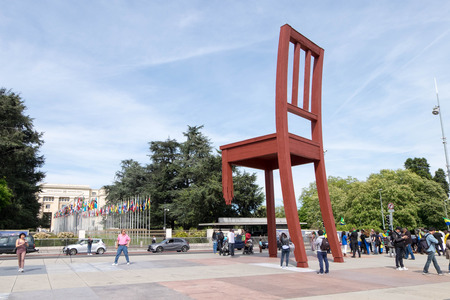 May 10, 2017 - Geneva, Switzerland: Red broken chair in front of United Nation headquarter office in Geneva. There were Gabon protesters making mob in peace as well.のeditorial素材